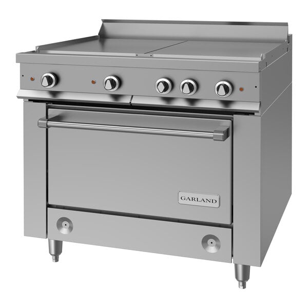 A heavy-duty stainless steel electric range with four control knobs, a flat cooking surface, and a standard oven below, branded Garland.