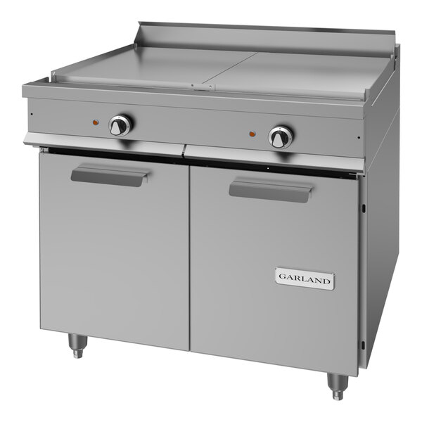 A heavy-duty stainless steel electric range with two top sections and a storage base.