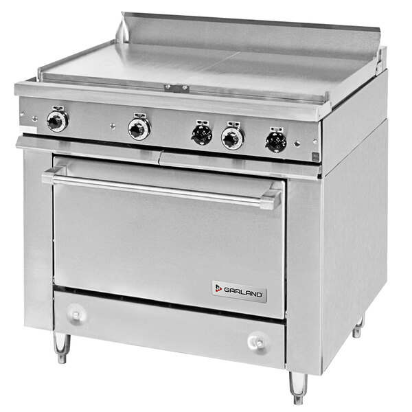 A stainless steel Garland commercial electric range with 2 all purpose top sections and knobs.