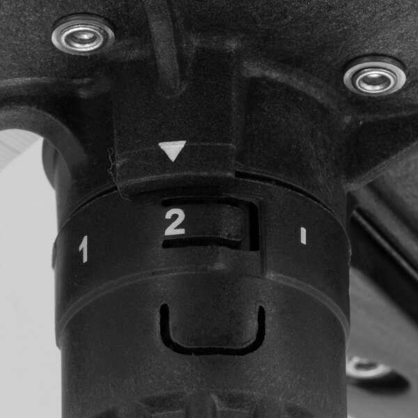 A close up of a black and white Waring adjustable slicing disc.