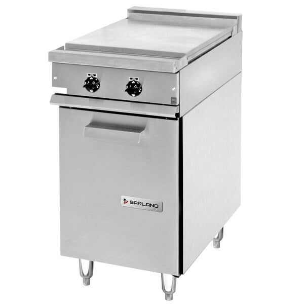 A large stainless steel Garland electric range with 2 boiler tops and storage base.