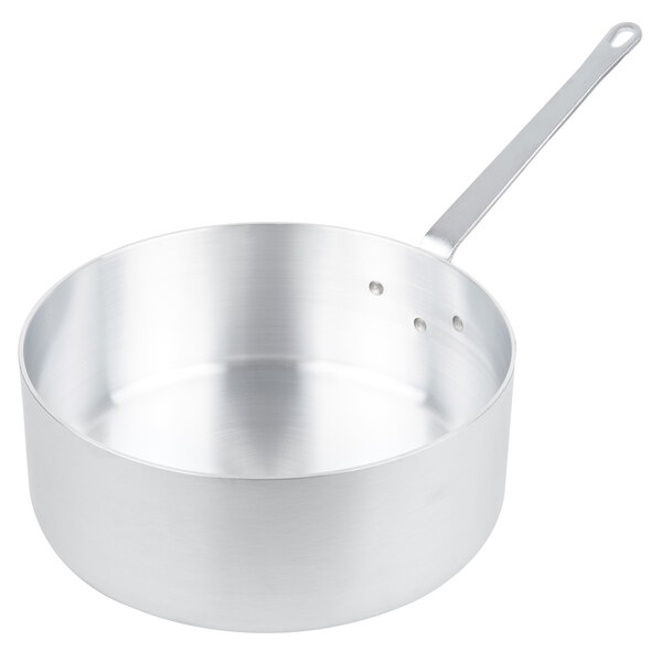 A silver aluminum Vollrath sauce pan with a handle.
