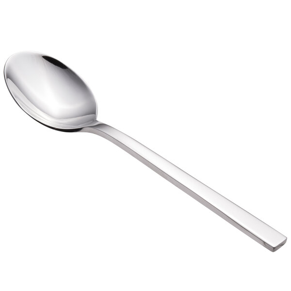 A close-up of a Walco stainless steel dessert spoon with a silver handle.
