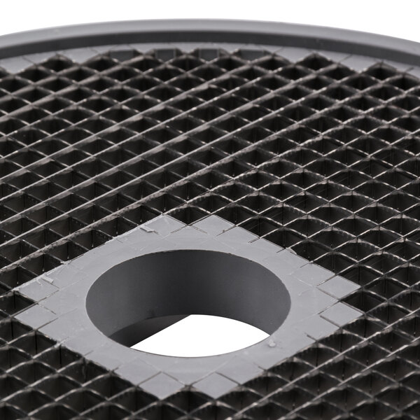 A black plastic disc with a hole in it.