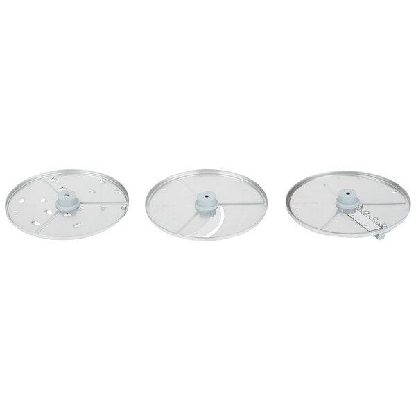 A white circular Robot Coupe disc set with three discs.