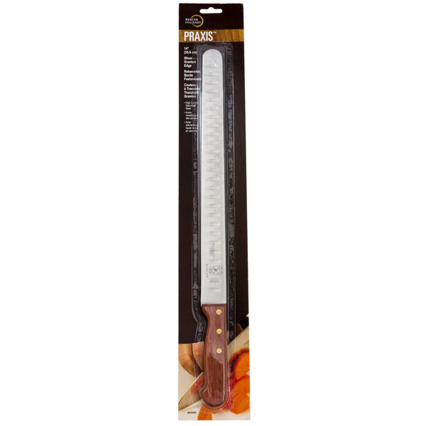 A Mercer Culinary Praxis Granton Edge Slicer Knife with a rosewood handle in a box.