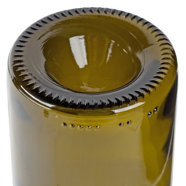A close up of a Libbey Dark Olive wine bottle tumbler with a metal cap on top.