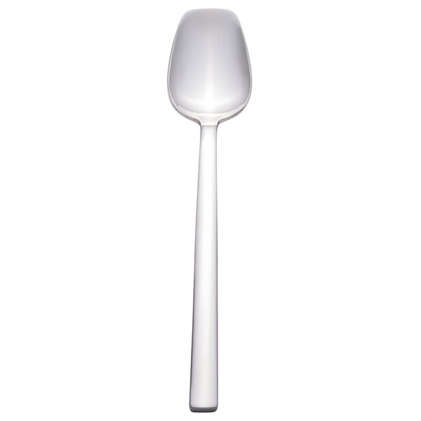 A Walco stainless steel dessert spoon with a white handle and silver spoon.