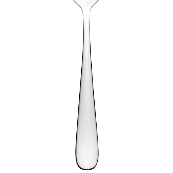 A close-up of a Walco stainless steel dessert spoon with a silver bowl and handle.