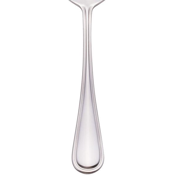 A Walco Pacific Rim stainless steel dessert spoon with a handle.