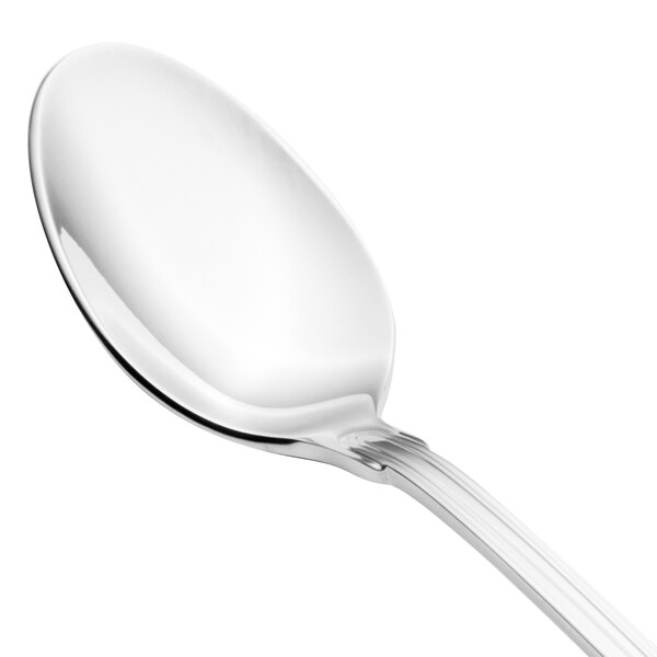 A close-up of a Walco Luxor iced tea spoon with a silver handle.