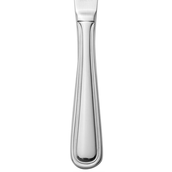 A silver Walco Pacific Rim table knife with a handle.