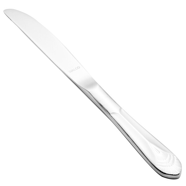A close-up of a Walco stainless steel butter knife with a silver handle.