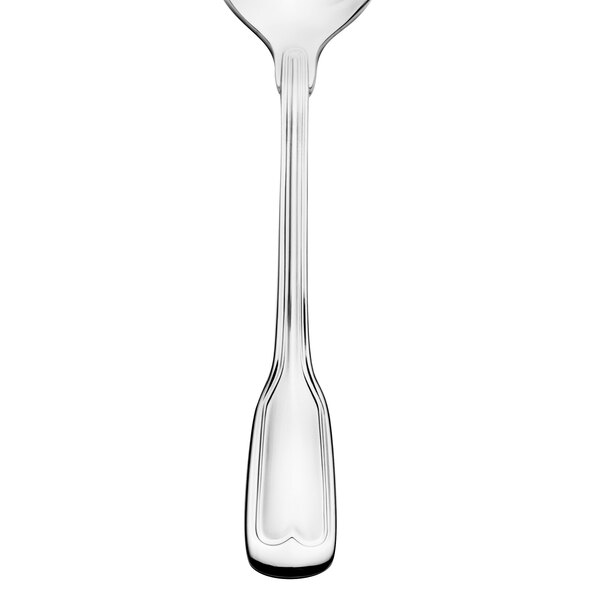 A close-up of a Walco Luxor stainless steel teaspoon with a handle.