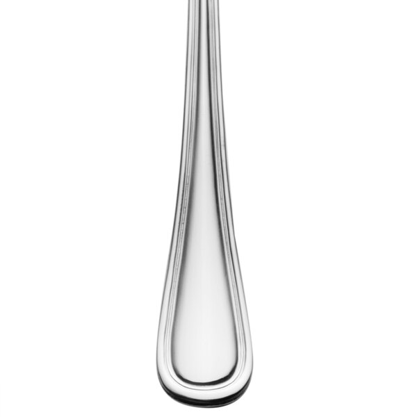 A close-up of a Walco Pacific Rim stainless steel iced tea spoon with a long handle.