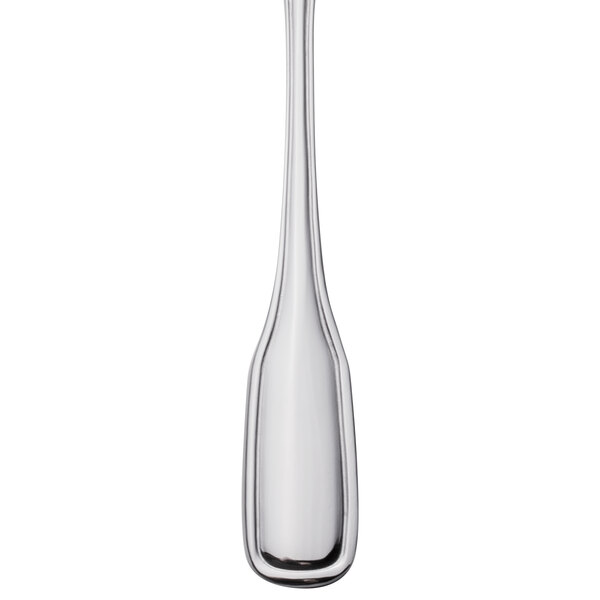 A Walco stainless steel butter spreader with a flat handle.