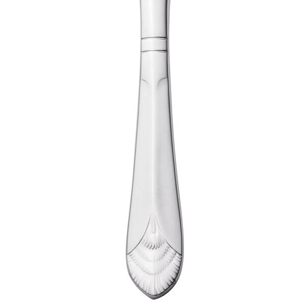 A Walco Meteor stainless steel dinner knife with a handle.