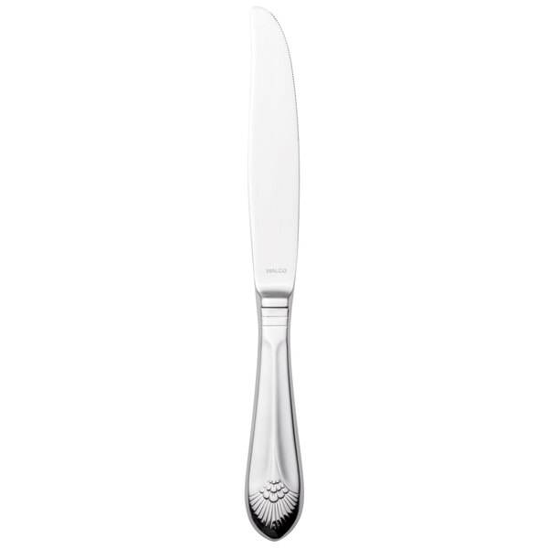 A silver Walco Meteor stainless steel table knife with a white handle.