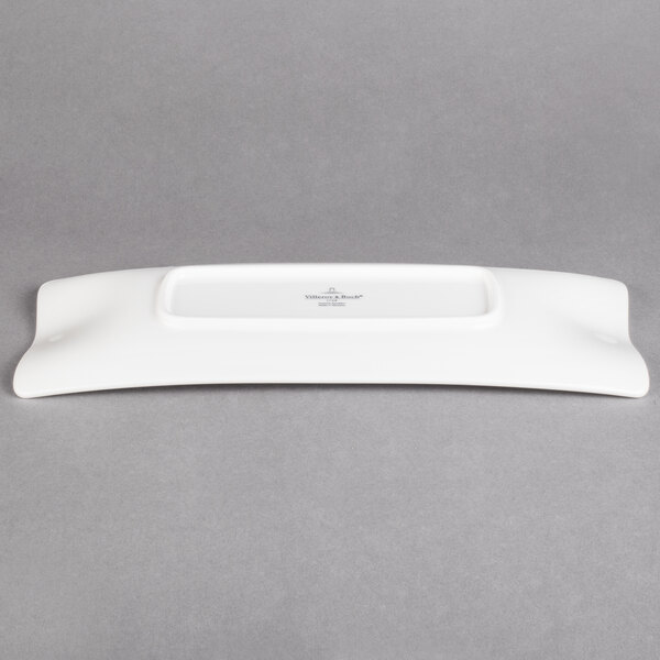 A white rectangular Villeroy & Boch porcelain plate with black text on it.