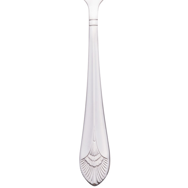 A Walco stainless steel cocktail fork with a white handle.