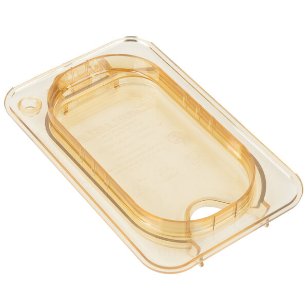 A clear plastic container with a Carlisle amber high heat hinged lid with one notch.