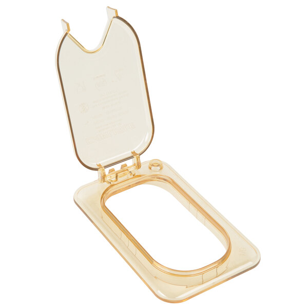 A Carlisle amber plastic container lid with a hinged lid.