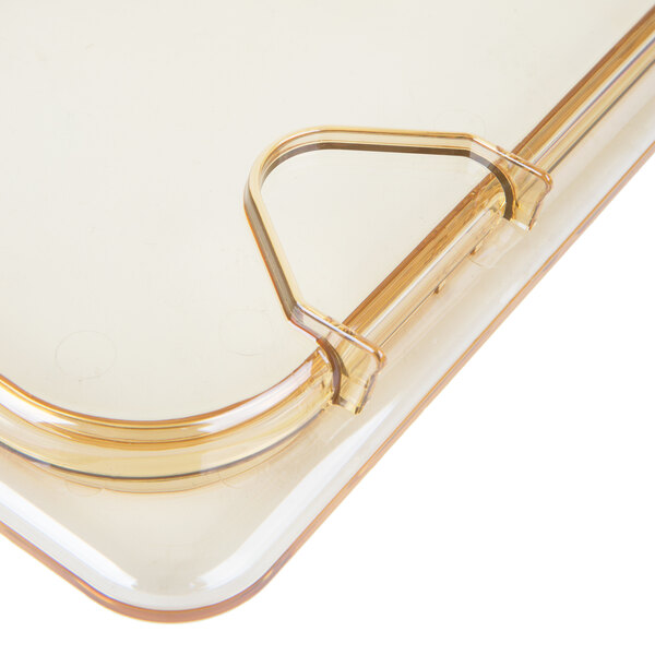 A clear plastic lid with a hook.
