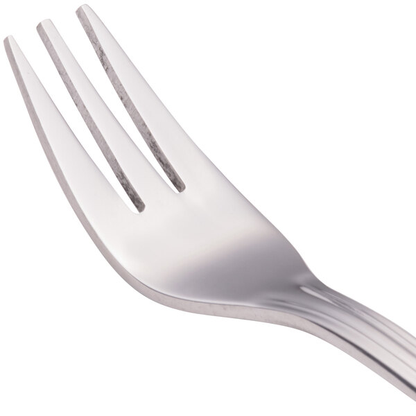 A close-up of a Walco stainless steel cocktail fork with a silver handle.