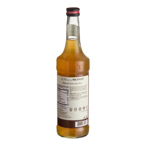 A 750 mL bottle of Monin Zero Calorie Natural Hazelnut Flavoring Syrup.