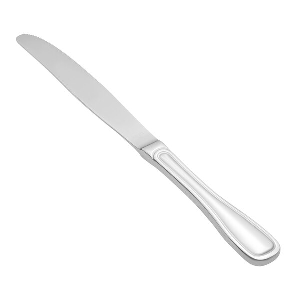A Walco Saville stainless steel dinner knife with a white background.