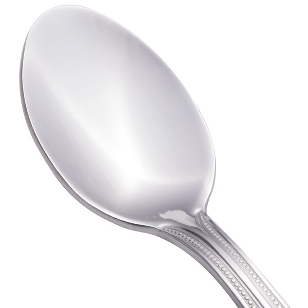 A Walco stainless steel teaspoon with a silver handle and spoon.