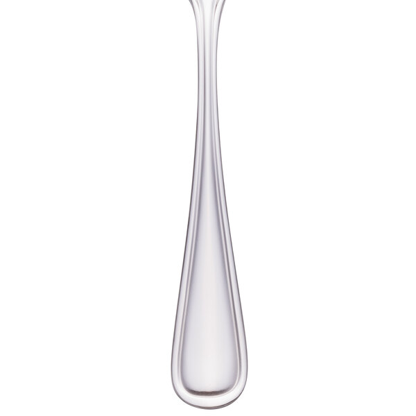 A Walco stainless steel teaspoon with a white handle and silver spoon.