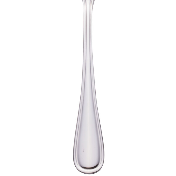 A Walco stainless steel table fork with a white handle.
