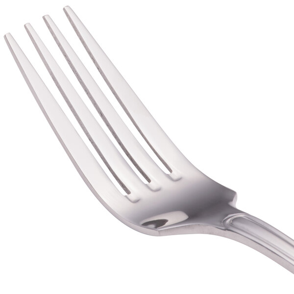 A close-up of four Walco Saville stainless steel dinner forks.