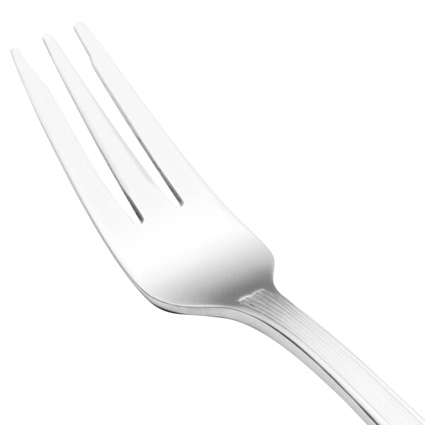 A close-up of a Walco stainless steel cocktail fork with a white handle.