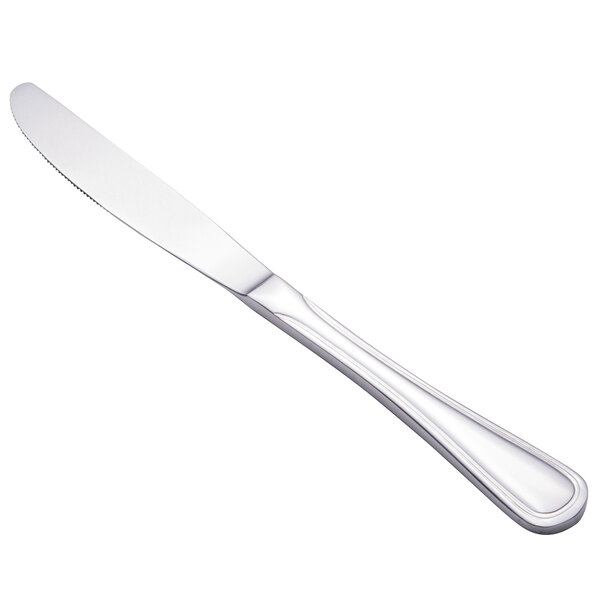 A close-up of a Walco Lisbon stainless steel dinner knife with a silver handle.