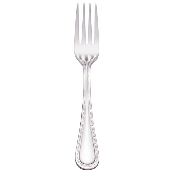 A silver Walco stainless steel dinner fork.