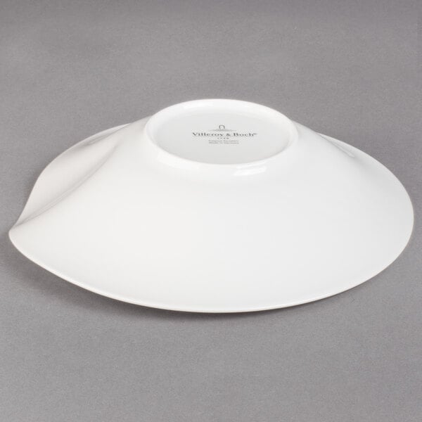 A white Villeroy & Boch deep bowl on a gray surface.