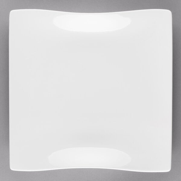 A white square plate with a curved edge.