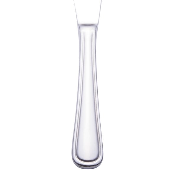 A close-up of a Walco stainless steel table knife with a white handle.