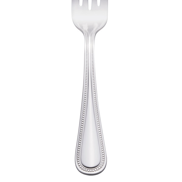 A Walco stainless steel salad fork with a beaded design on the handle.
