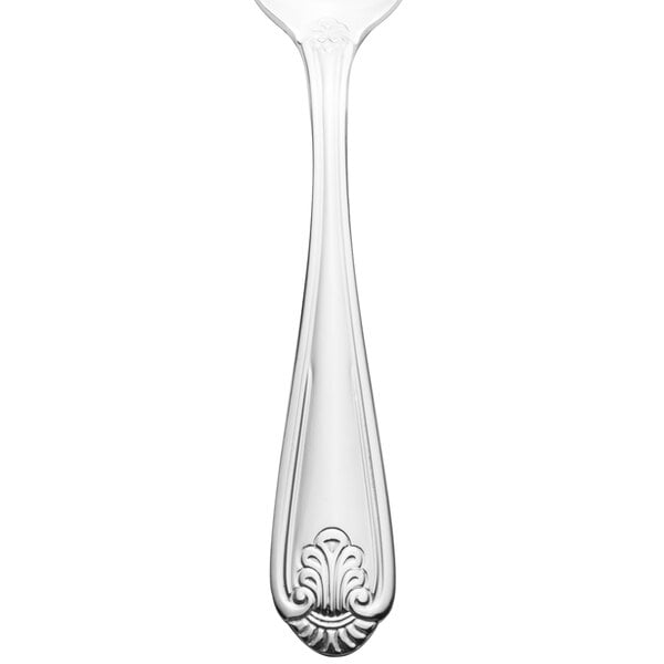 A close-up of a Walco stainless steel teaspoon with a handle.