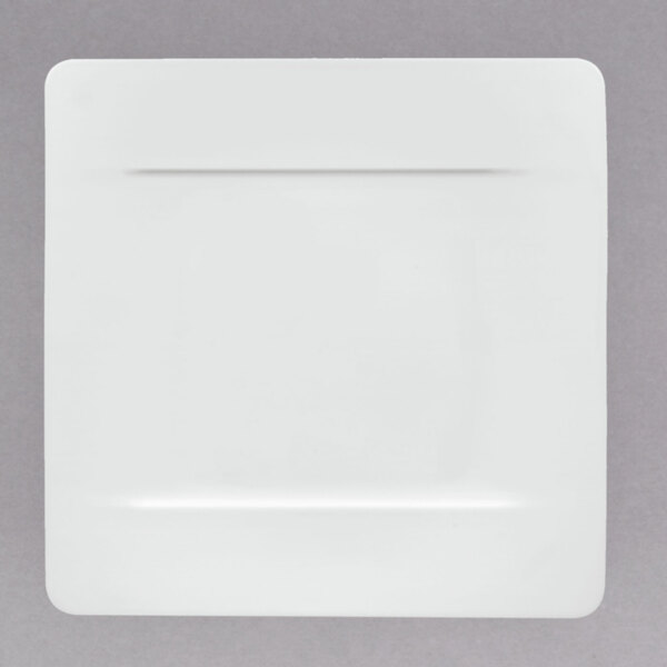 A white square Villeroy & Boch bone porcelain plate with a thin black line around the edge.