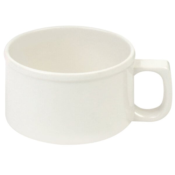 A white cup with a handle.