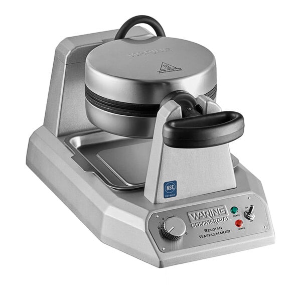 A Waring single Belgian waffle maker on a school kitchen counter.