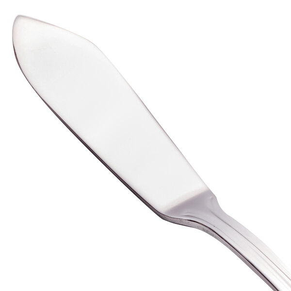 A Walco stainless steel butter spreader with a white handle.