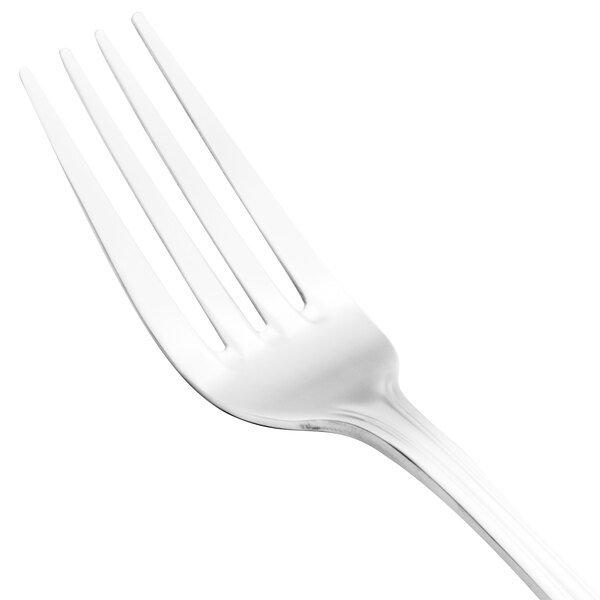 A close-up of a Walco stainless steel dinner fork with a white handle.