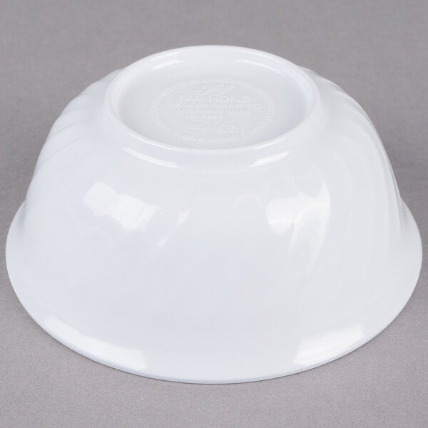 A white Thunder Group melamine bowl with a swirl design.