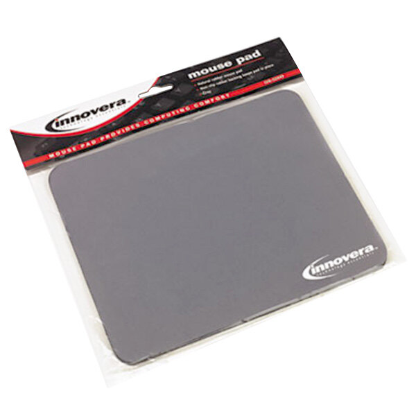A grey Innovera mouse pad with a black logo on it in a white box.