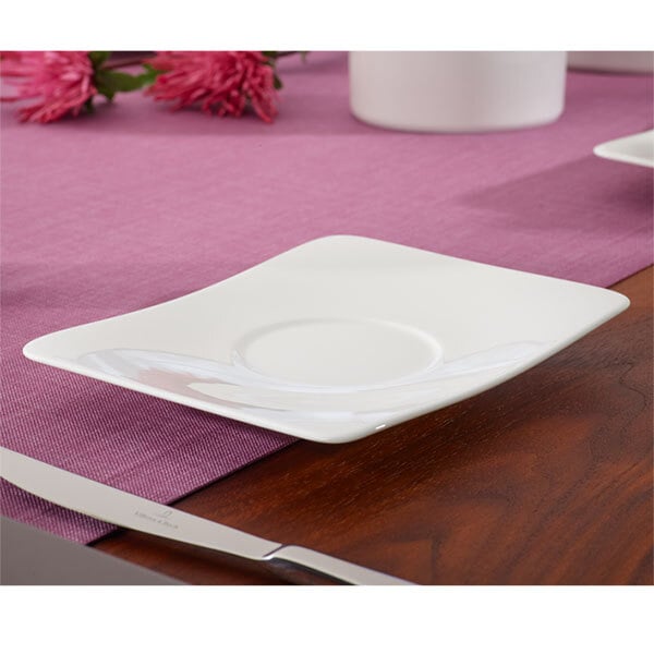 A white Villeroy & Boch Modern Grace bone porcelain saucer on a table.